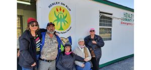 Members of the HCPF show off the beanies knitted for patrollers by Drienie Naude (right)